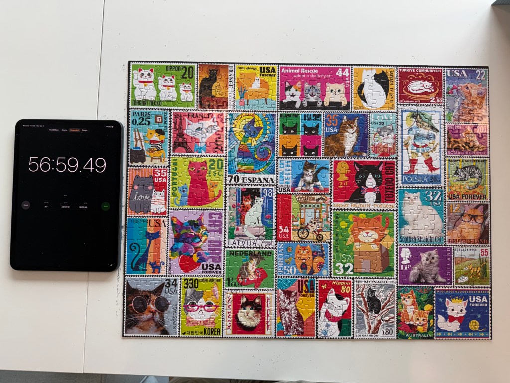 Picture of a cat stamp puzzle with a timer saying 56 minutes 59 seconds